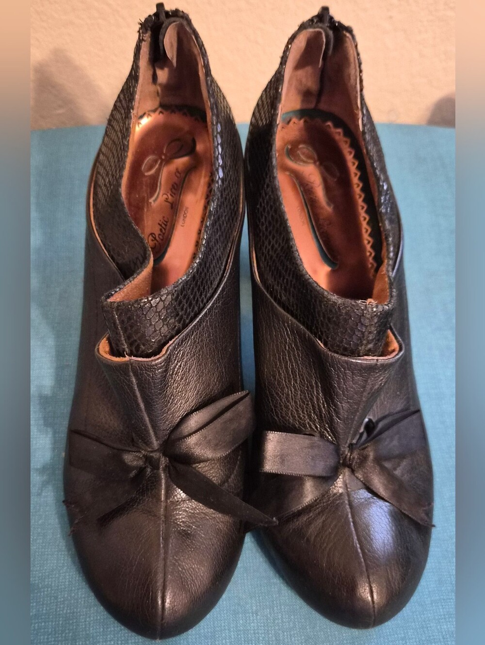 Poetic License Black Leather Knot-Front Heeled Booties